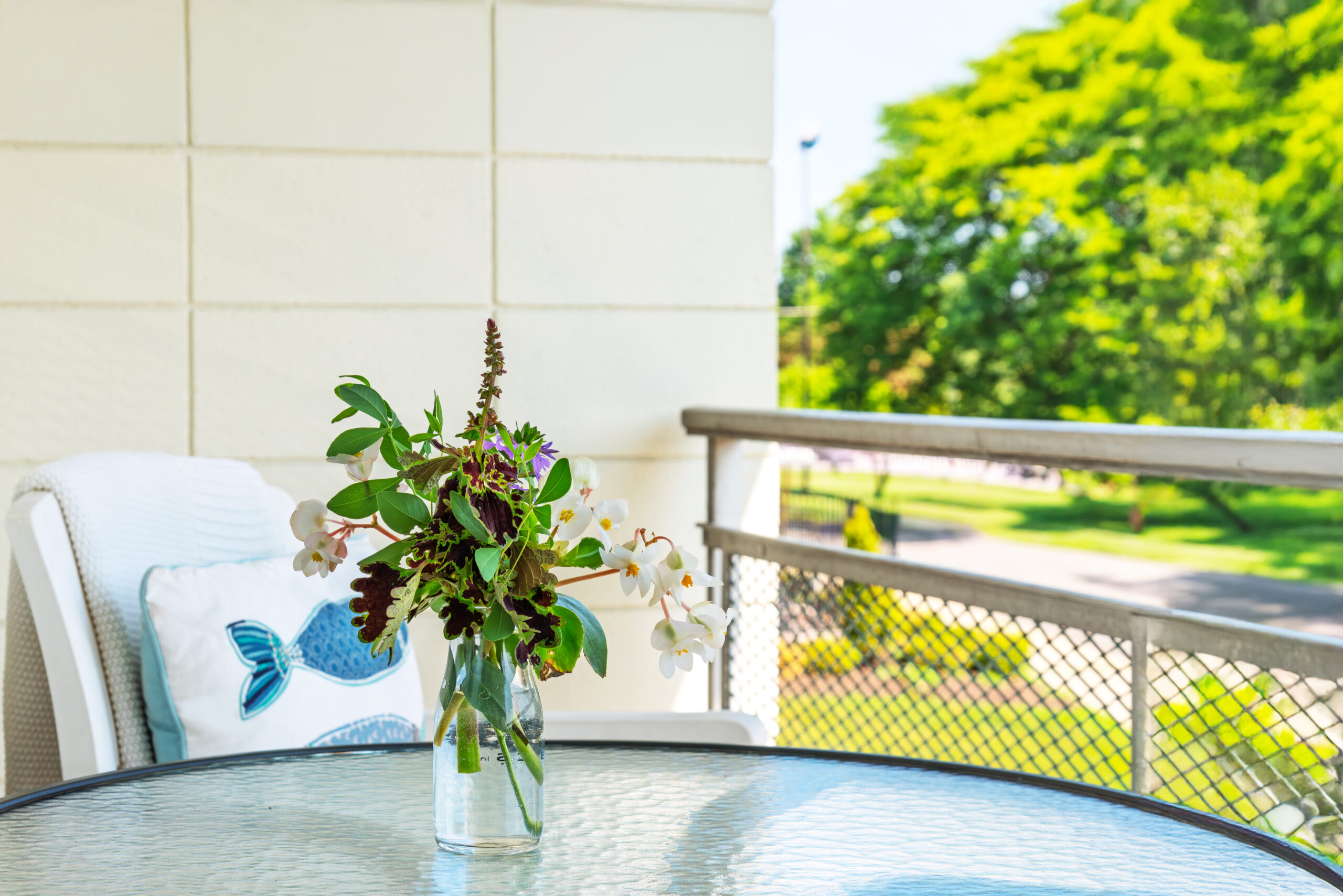 Balcony with flower boxes and garden view at The Residences, Hadley, MA