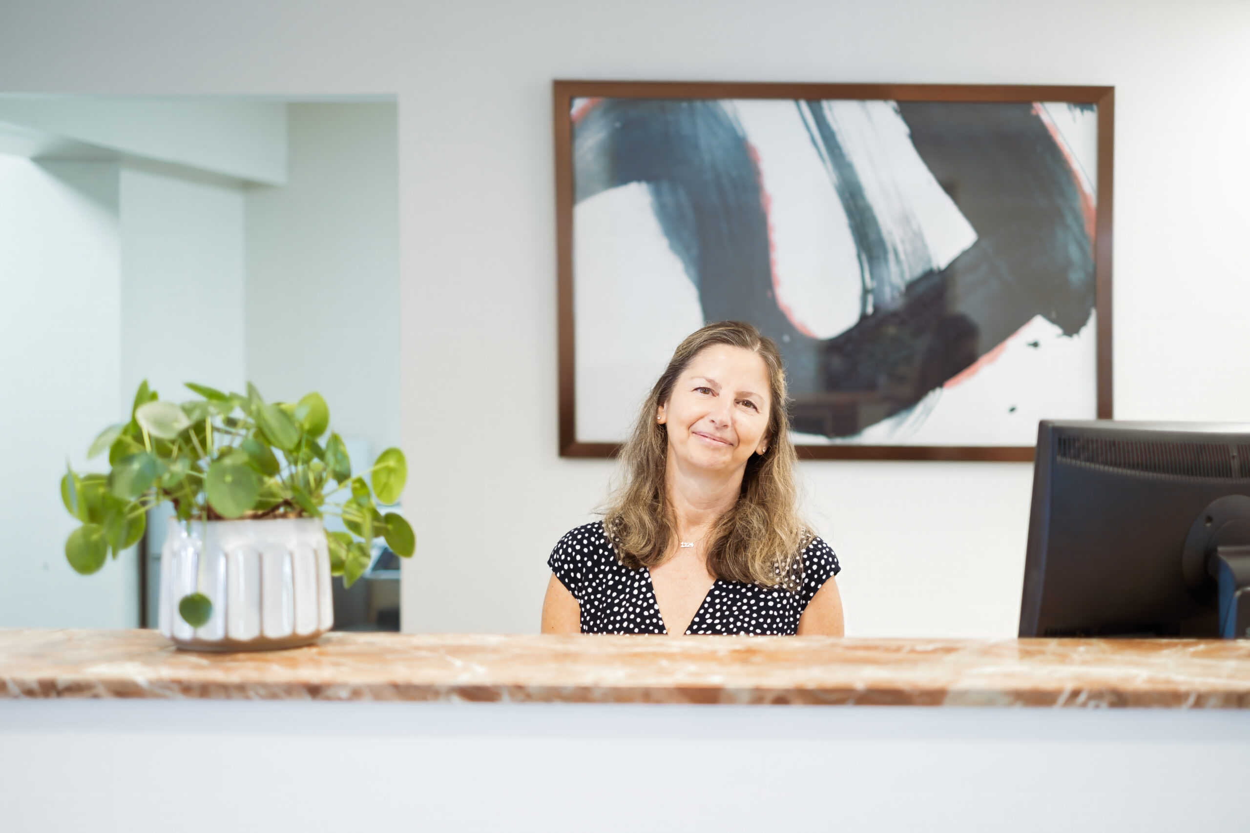 Friendly staff member at the front desk of The Residences, Hadley, MA
