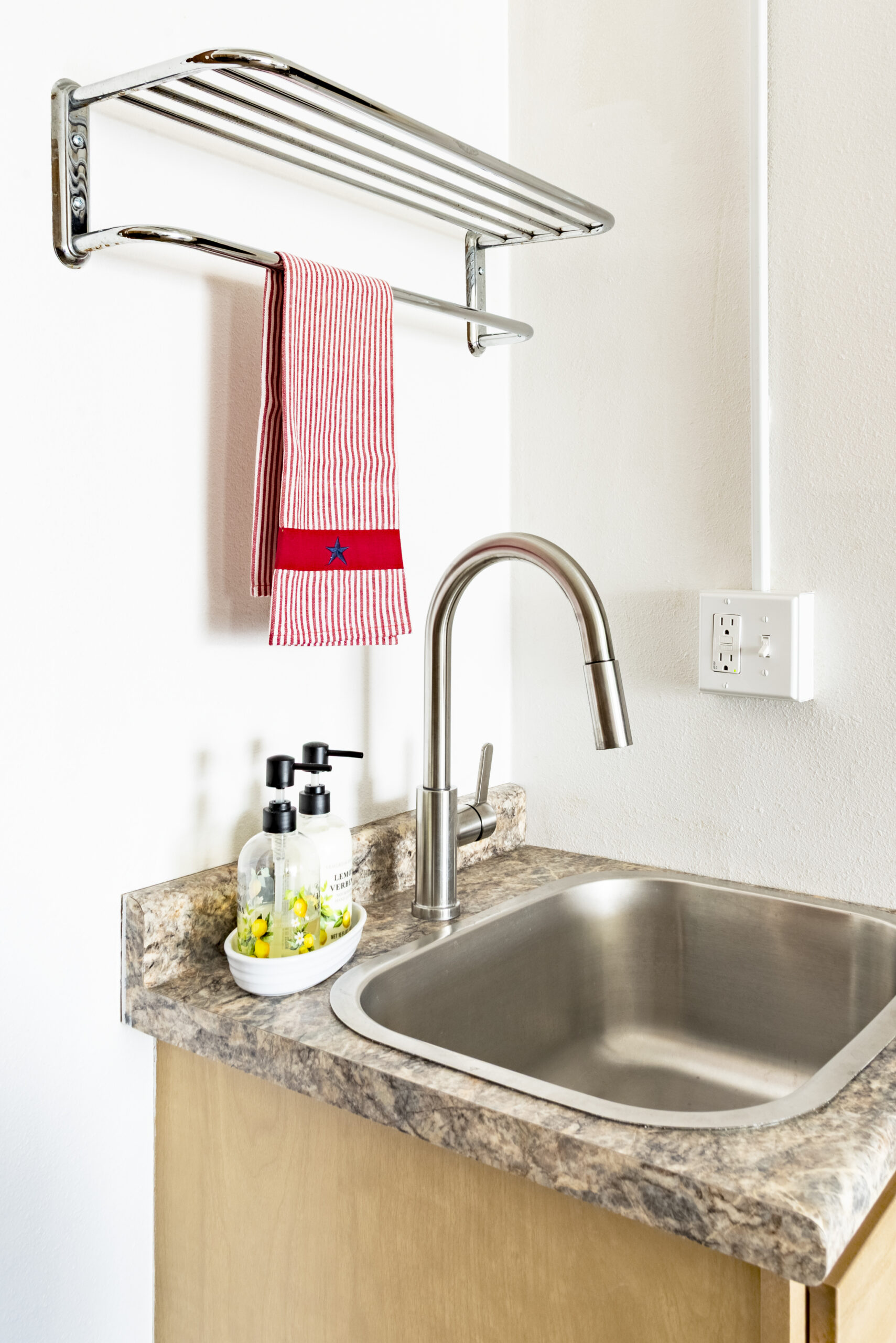 Kitchenette sink with granite countertop at The Residences, Hadley, MA