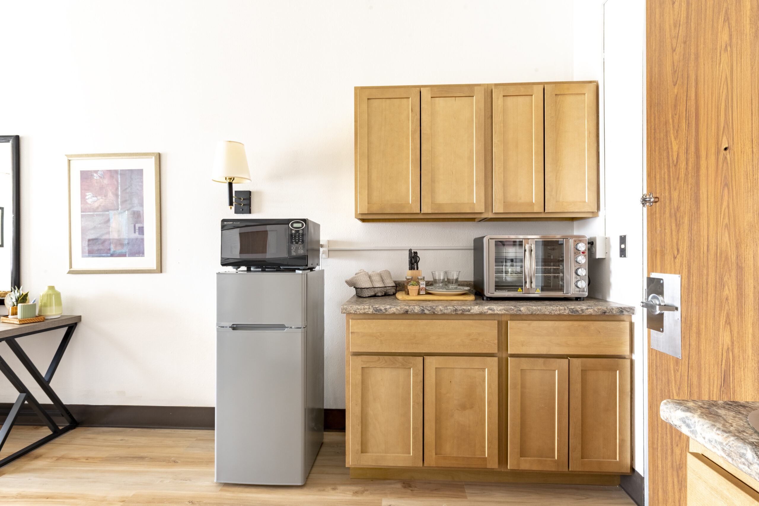 Kitchenette with upper and lower cabinets at The Residences, Hadley, MA