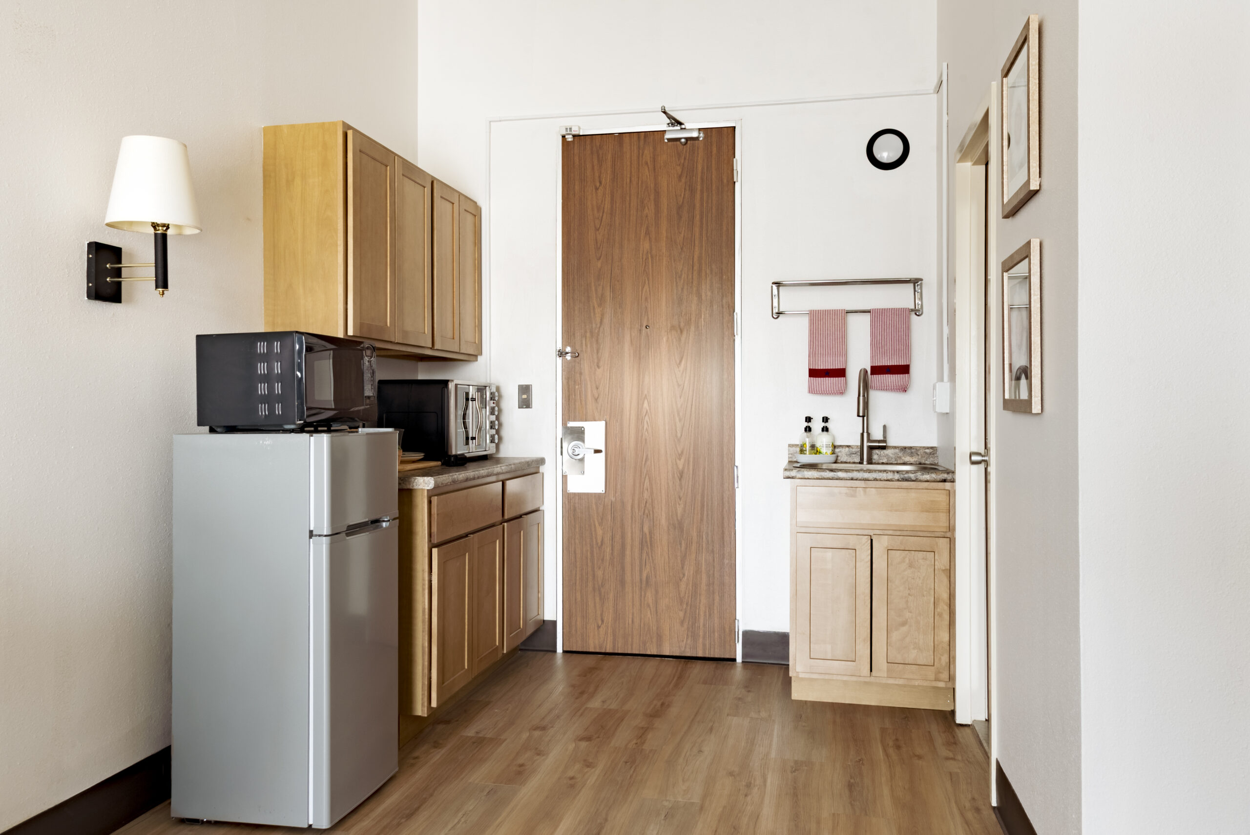 Fully equipped kitchenette with refrigerator and microwave at The Residences, Hadley, MA
