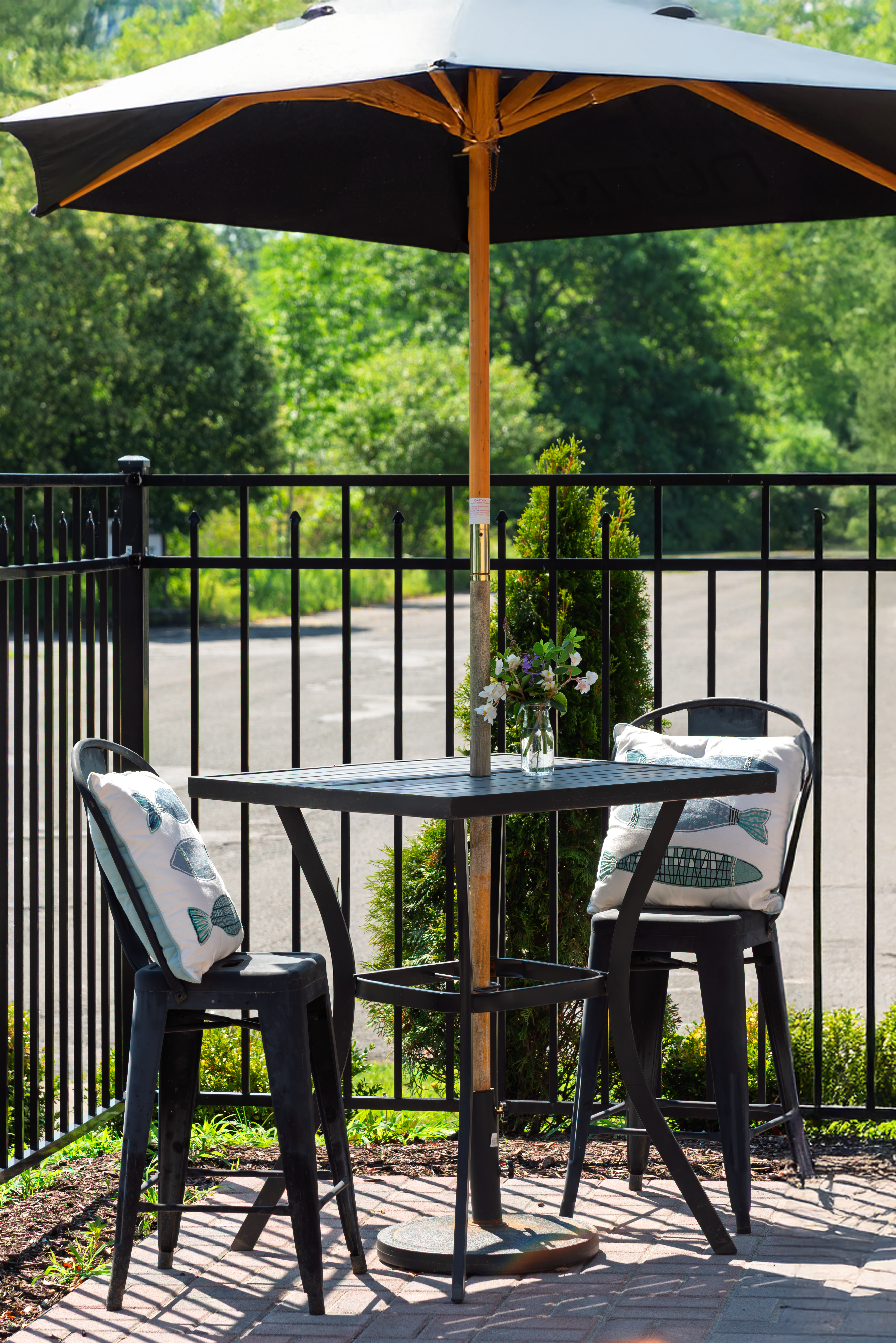 Outdoor patio bistro table and stools at The Residences, Hadley, MA