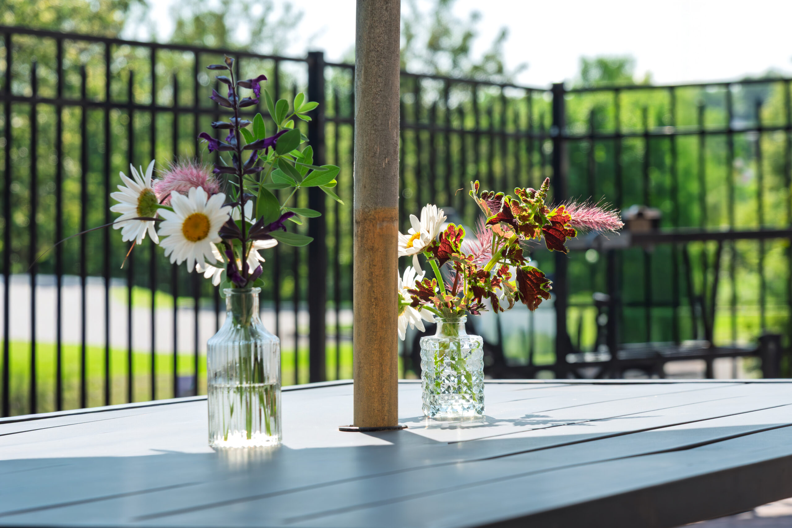 Outdoor patio with flower vases at The Residences, Hadley, MA