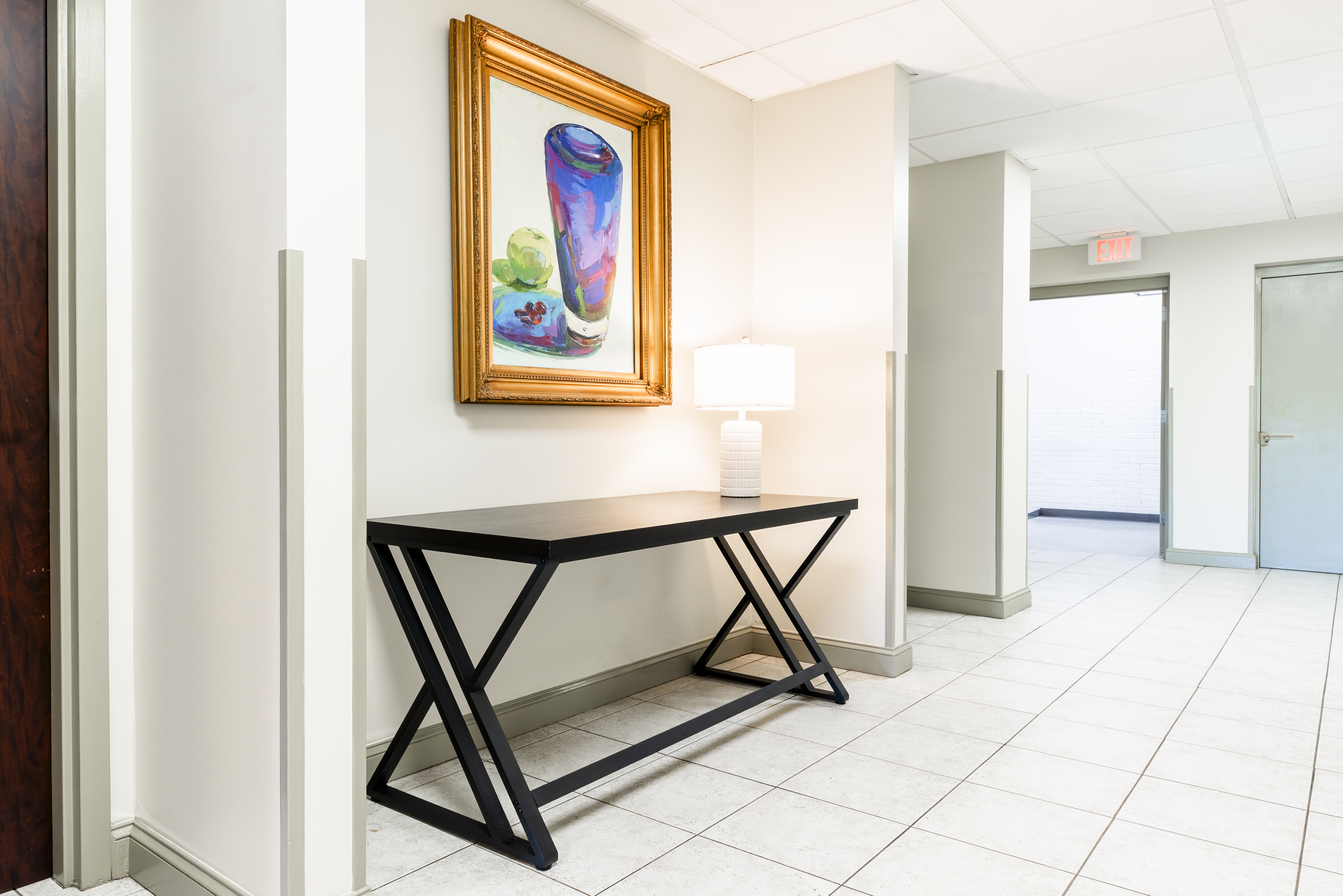 Hallway corridor with console table and artwork at The Residences, Hadley, MA