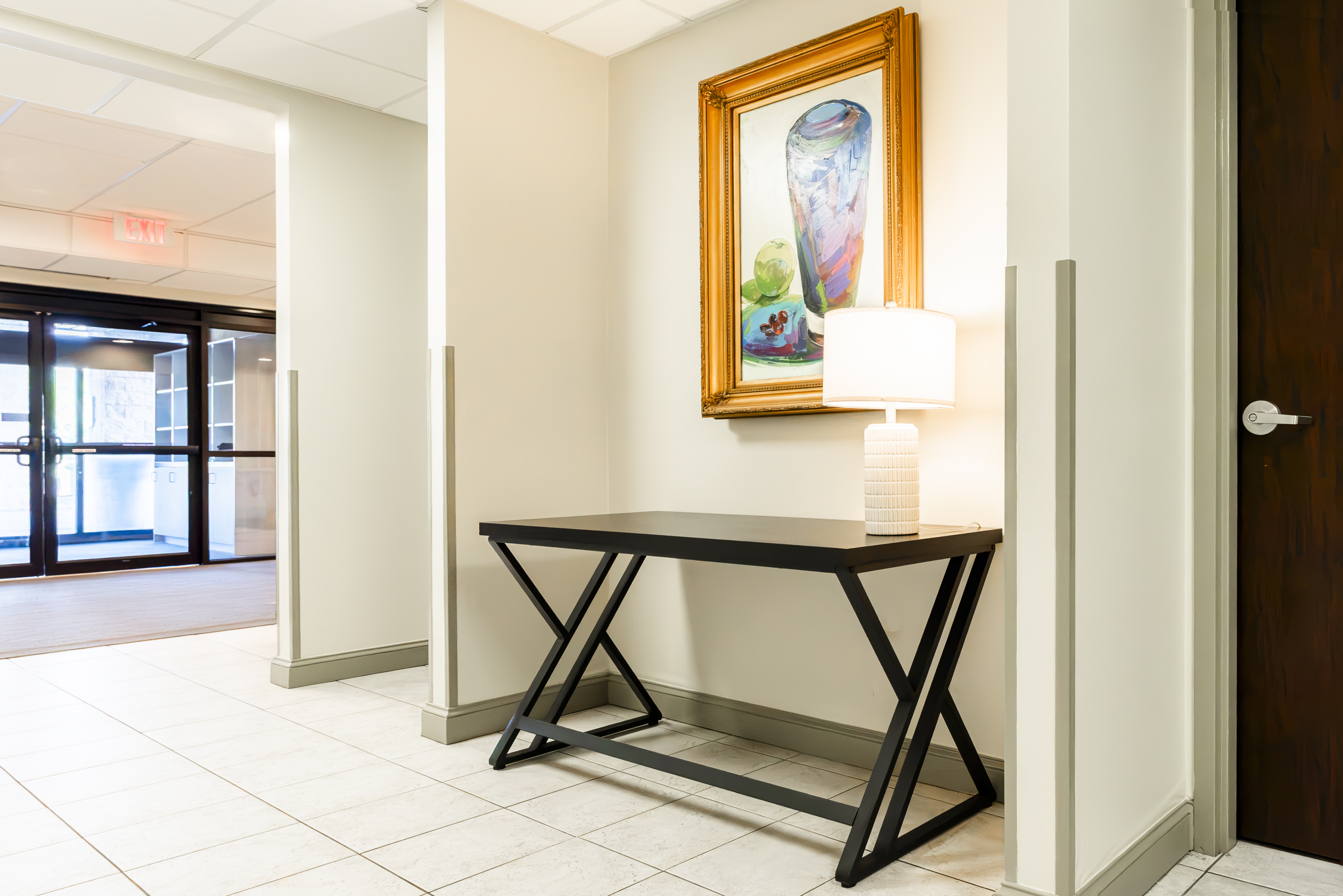 Entry view of hallway with console table and artwork at The Residences, Hadley, MA